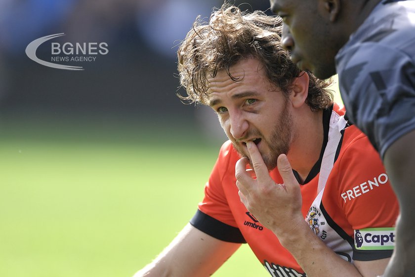 The Luton captain is in a stable condition after suffering a heart attack against Bournemouth