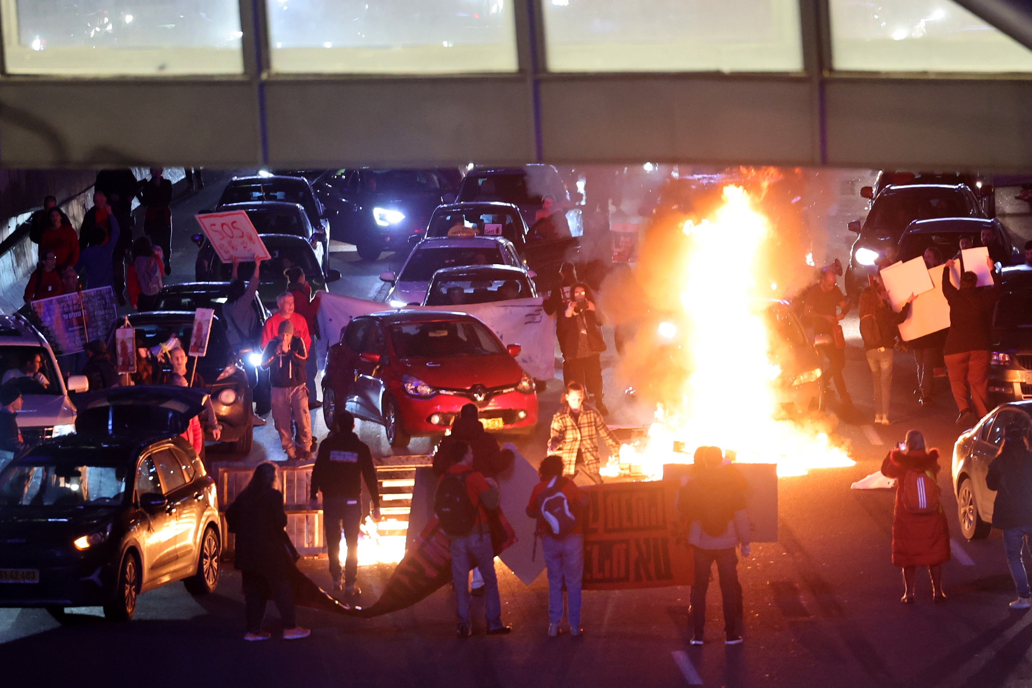 Protesters block highway in Tel Aviv and demand new elections