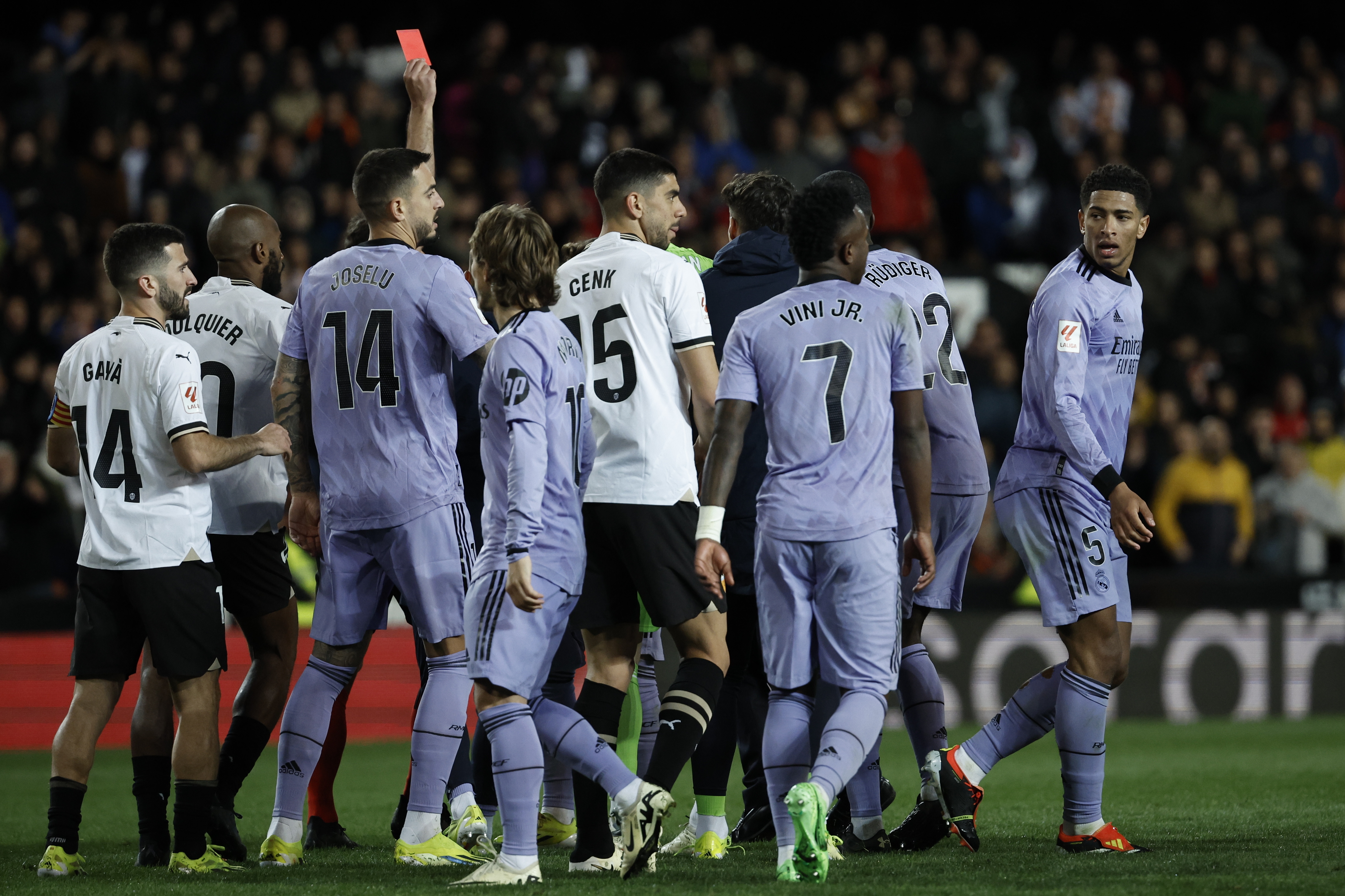 Valencia and Real Madrid share points after controversial end to game