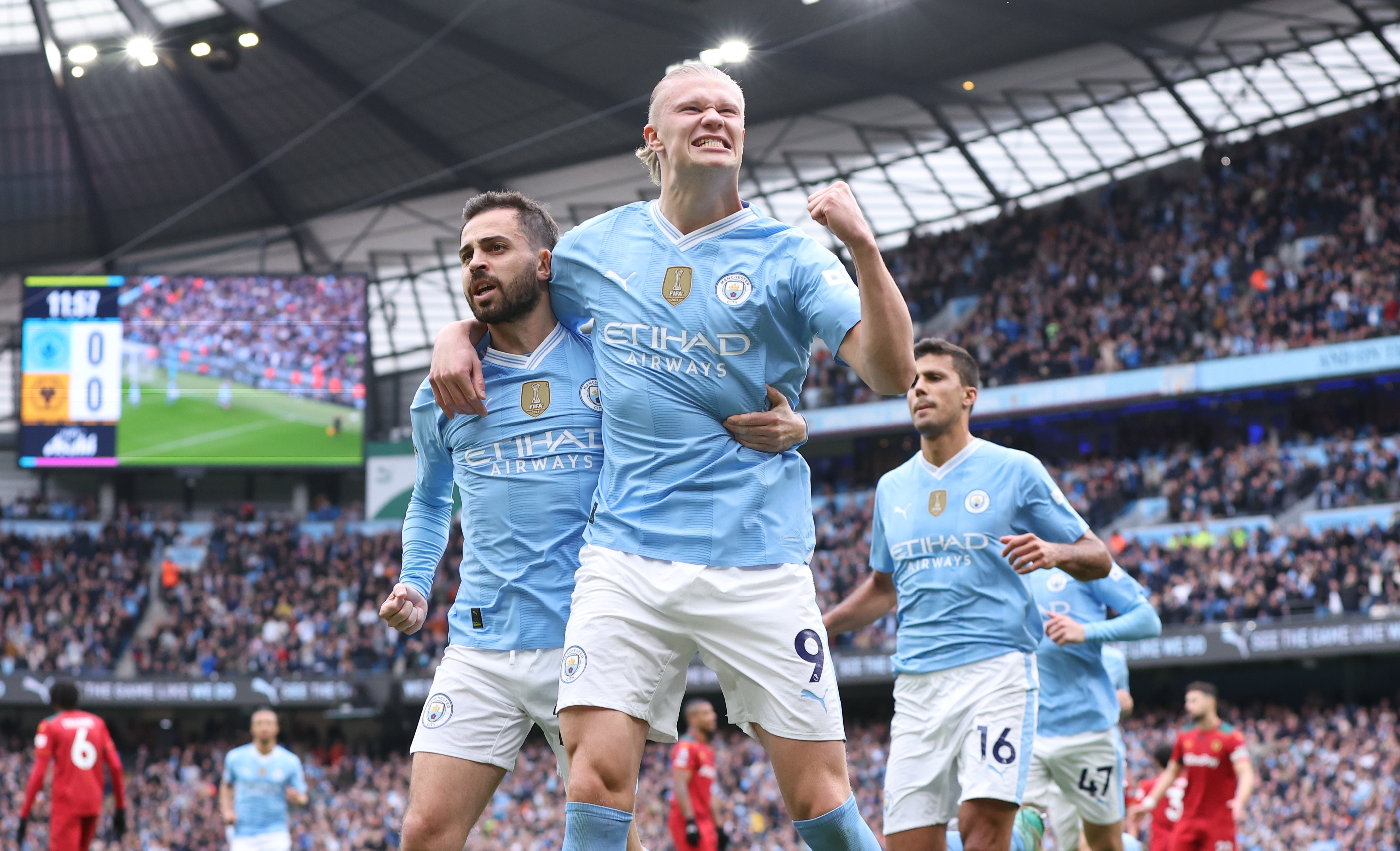 Four-goal Haaland keeps City one point behind Arsenal