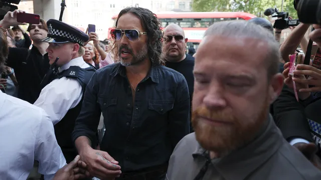 Russell Brand released on bail after appearing in court