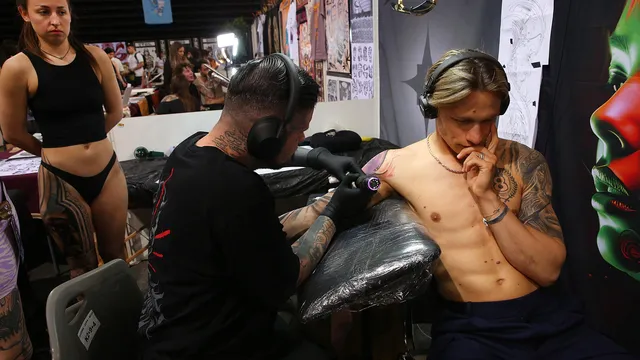 A tattoo of a cross mysteriously disappears from a Chinese man's neck, and a wound appears in its place